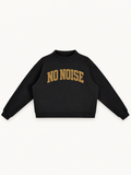 NO NOISE Essential Mock-Neck Sweatshirt — Onyx, front view showing antique-gold arched NO NOISE lettering and raised neckline.