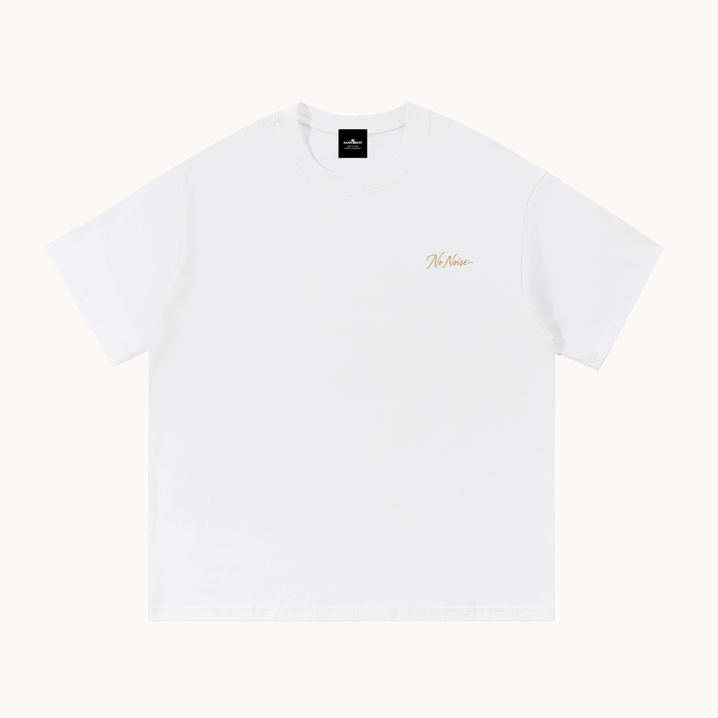 Essential Signature Tee in white, front view with small gold No Noise script at the left chest