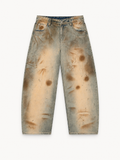 NO NOISE Patina Wide-Leg Jeans — Aged Sand, front view showing mottled aged wash, curved legs and five-pocket construction.