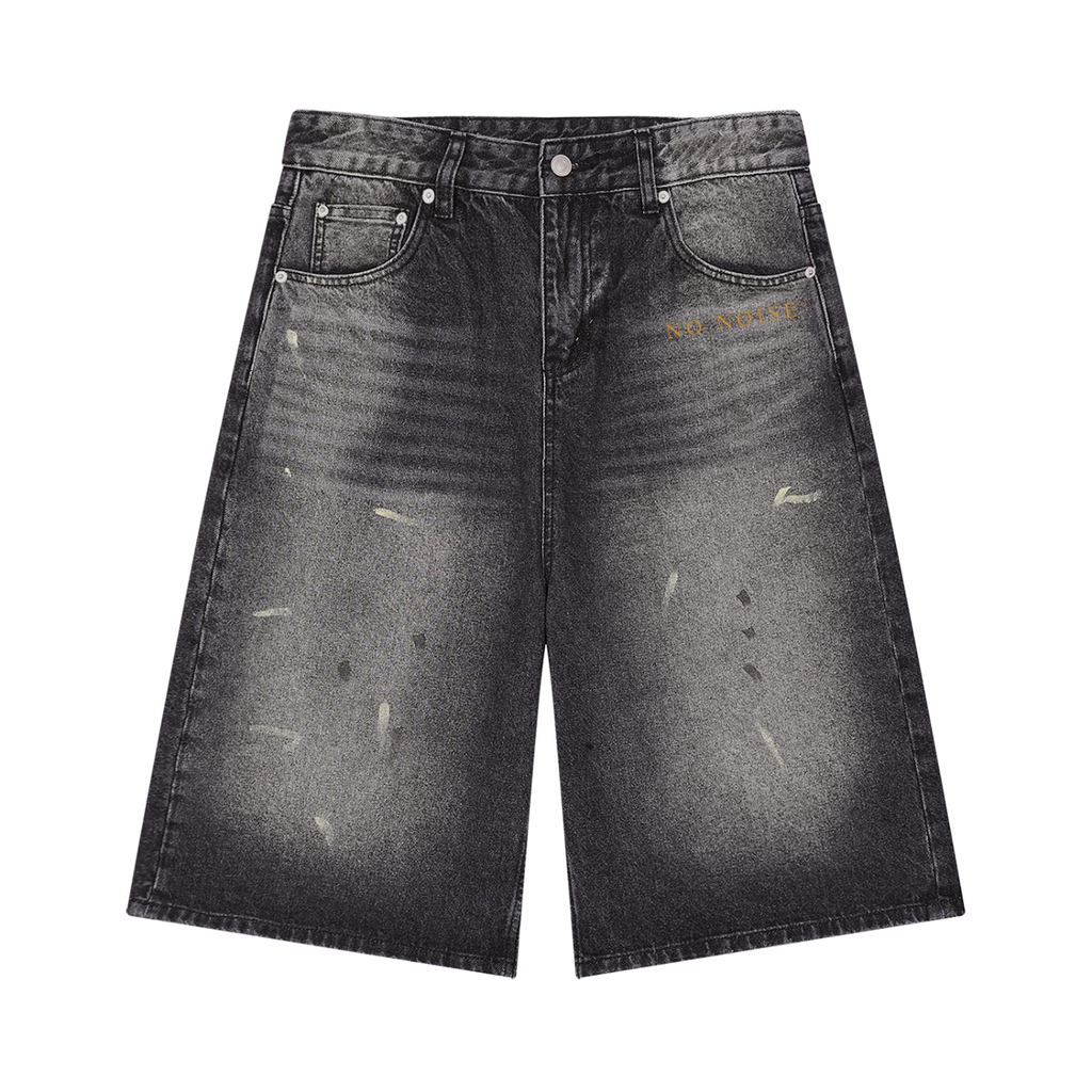 NO NOISE The Still Wide-Leg Denim Short — Faded Black, front view showing faded denim, wide legs and gold script.