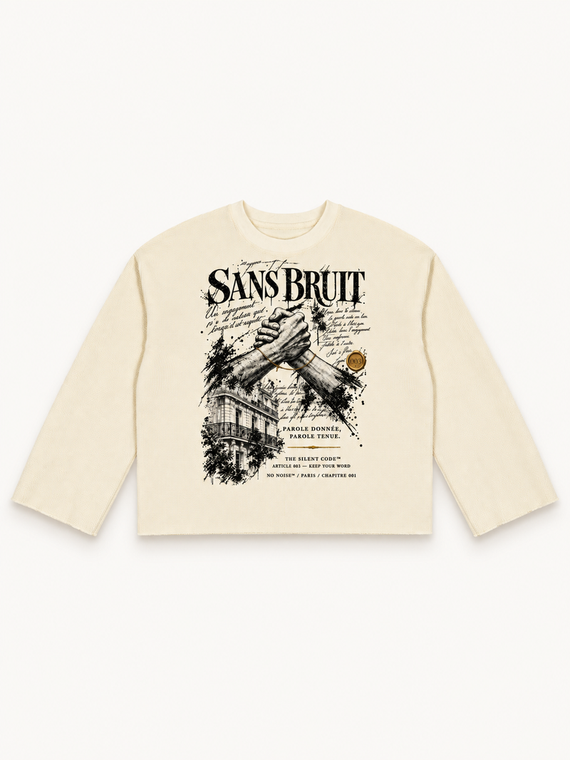 NO NOISE Silent Pact Waffle Raw-Edge Long Sleeve — Apricot, front flat view showing large SANS BRUIT graphic.