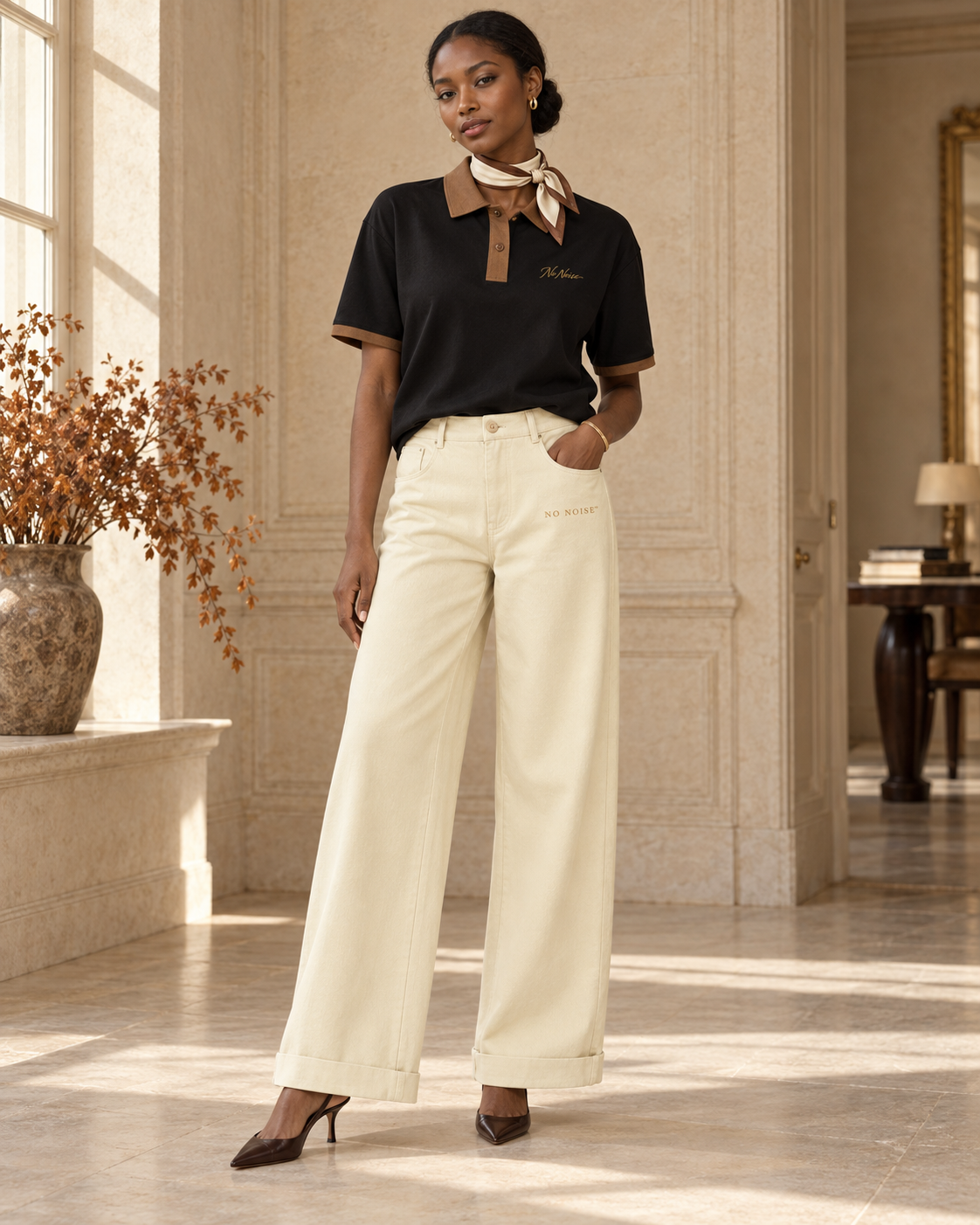 HER Fall–Winter look: Silent Standard Contrast Polo with apricot Silent Drape trousers, ivory neck scarf and heels.