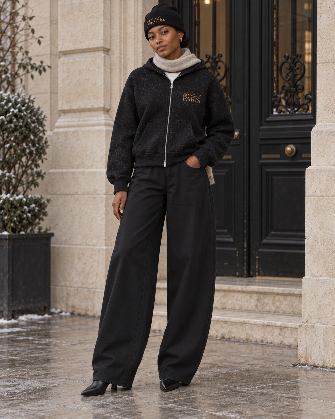 Winter styling illustration: Silent Cities hoodie, NO NOISE beanie, black trousers, oatmeal scarf and ankle boots.