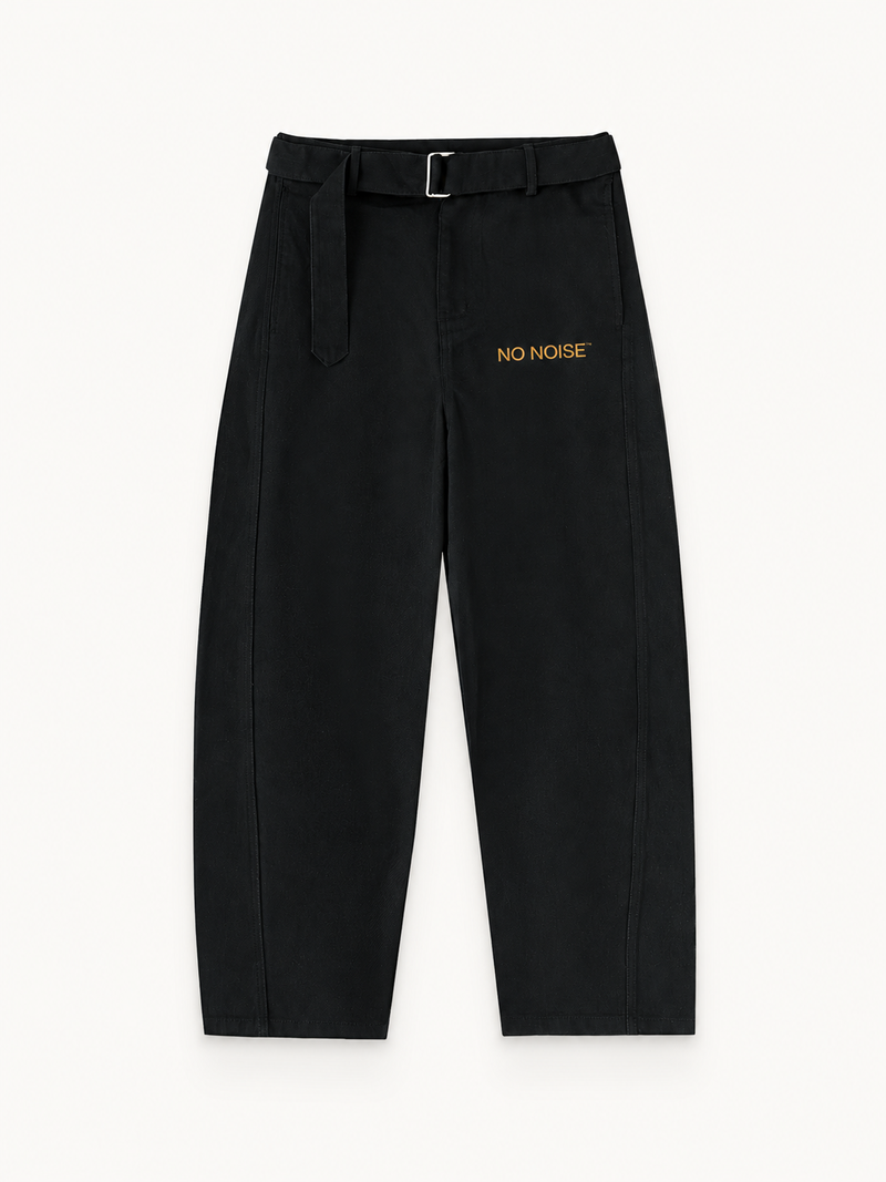 NO NOISE Belted Barrel-Leg Chino Pants — Black, front view showing the belt, curved legs and gold thigh lettering.