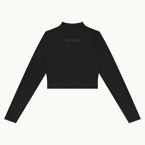 Form Cropped Jacket — Onyx, black, back view showing cropped hem and small gold lettering. On warm ivory.