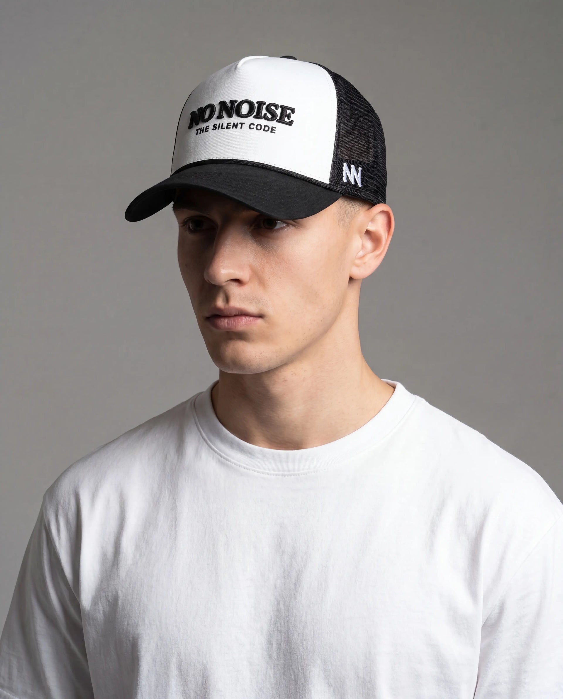 NO NOISE Light Code hat on model, front view