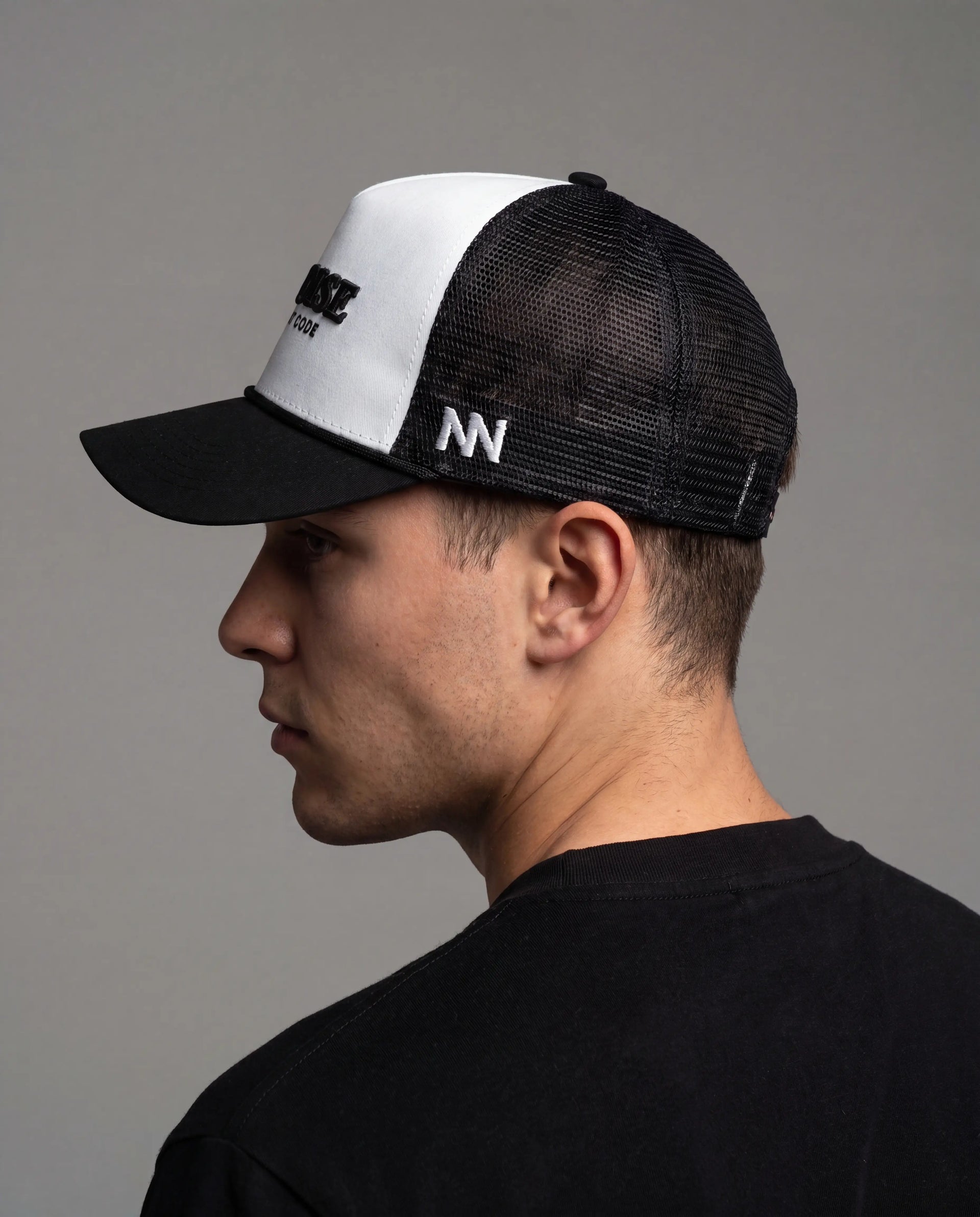 NO NOISE Light Code hat on model, side/back view