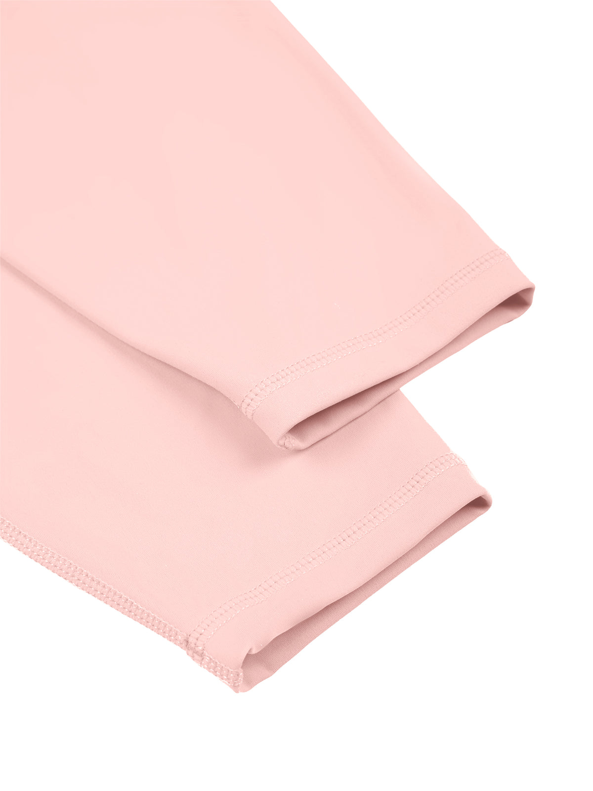NO NOISE Poise High-Rise Leggings — Petal, close view of the pink leg hems and stitching.