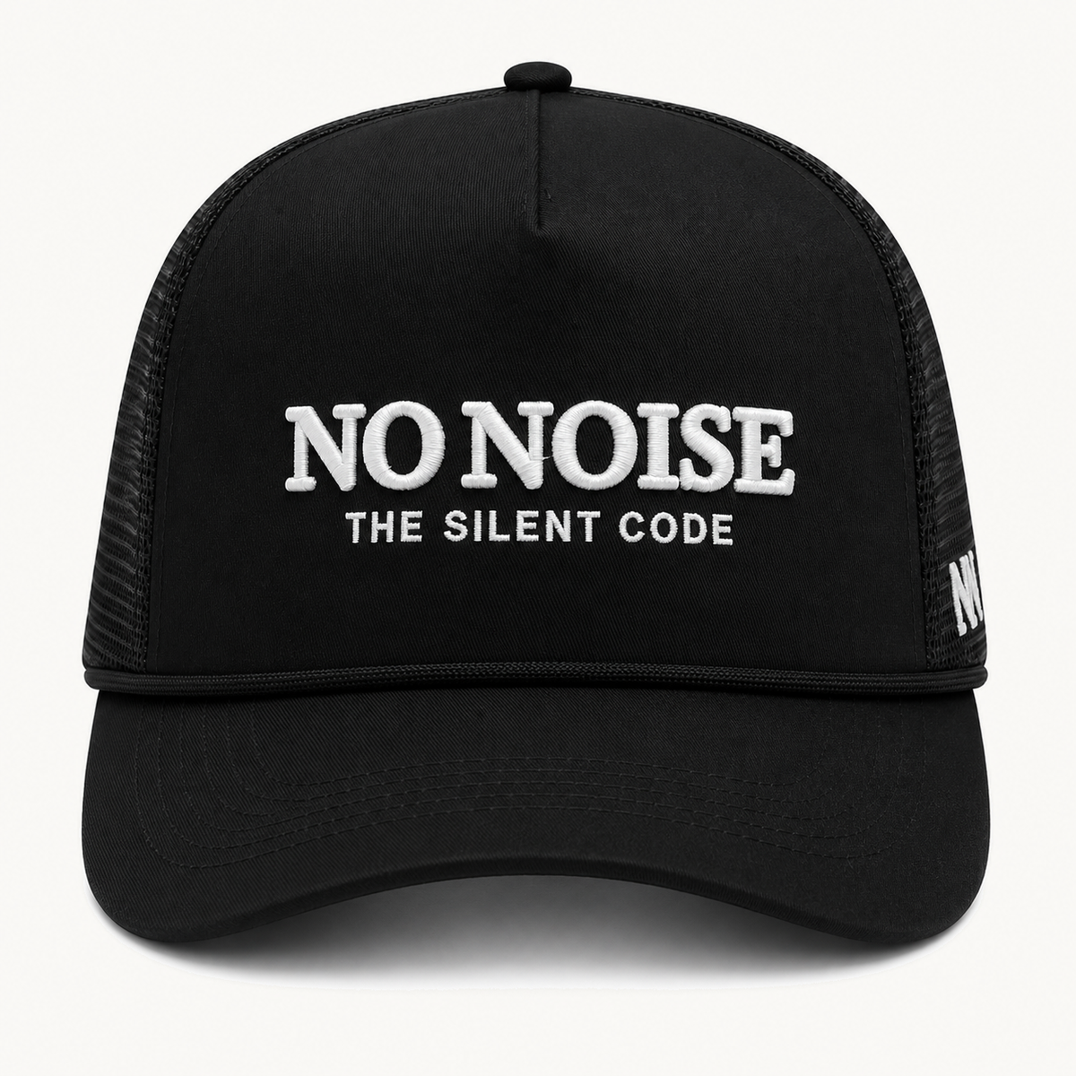 Shadow Code Trucker Hat — Black — product view on warm ivory.