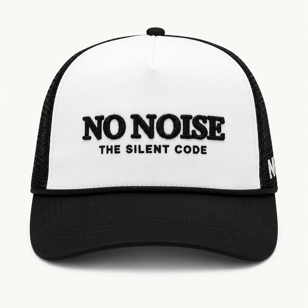 Light Code Trucker Hat — White/Black — product view on warm ivory.