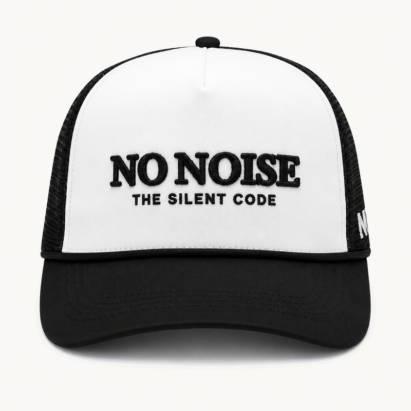 Light Code Trucker Hat — White/Black — product view on warm ivory.