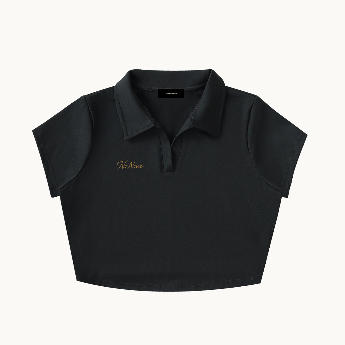 NO NOISE™ SILENT CODE CROPPED POLO — product view on warm ivory.