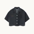 THE SILENT DENIM™ SHIRT — BLACK — product view on warm ivory.