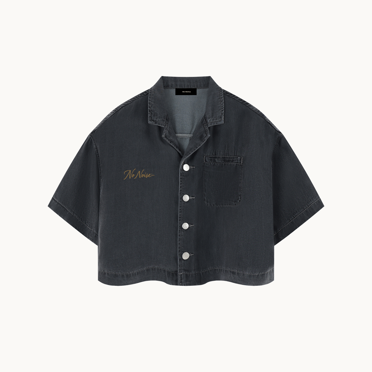 THE SILENT DENIM™ SHIRT — BLACK — product view on warm ivory.