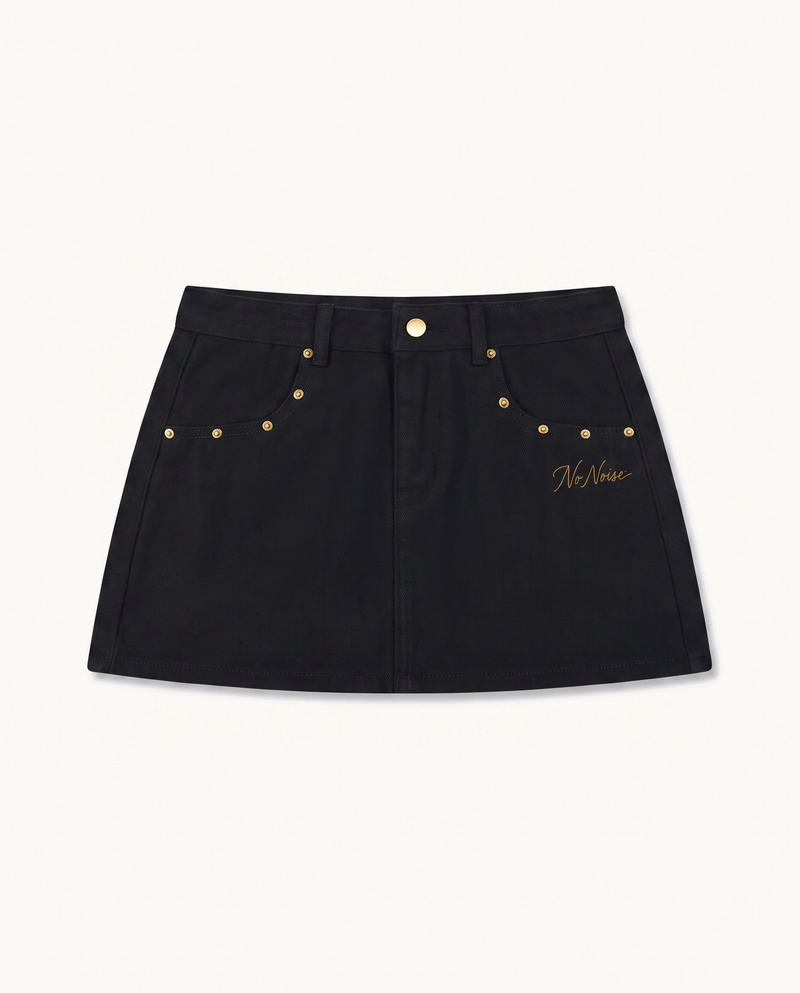 NO NOISE™ HER — RIVET DENIM MINI SKIRT — product view on warm ivory.