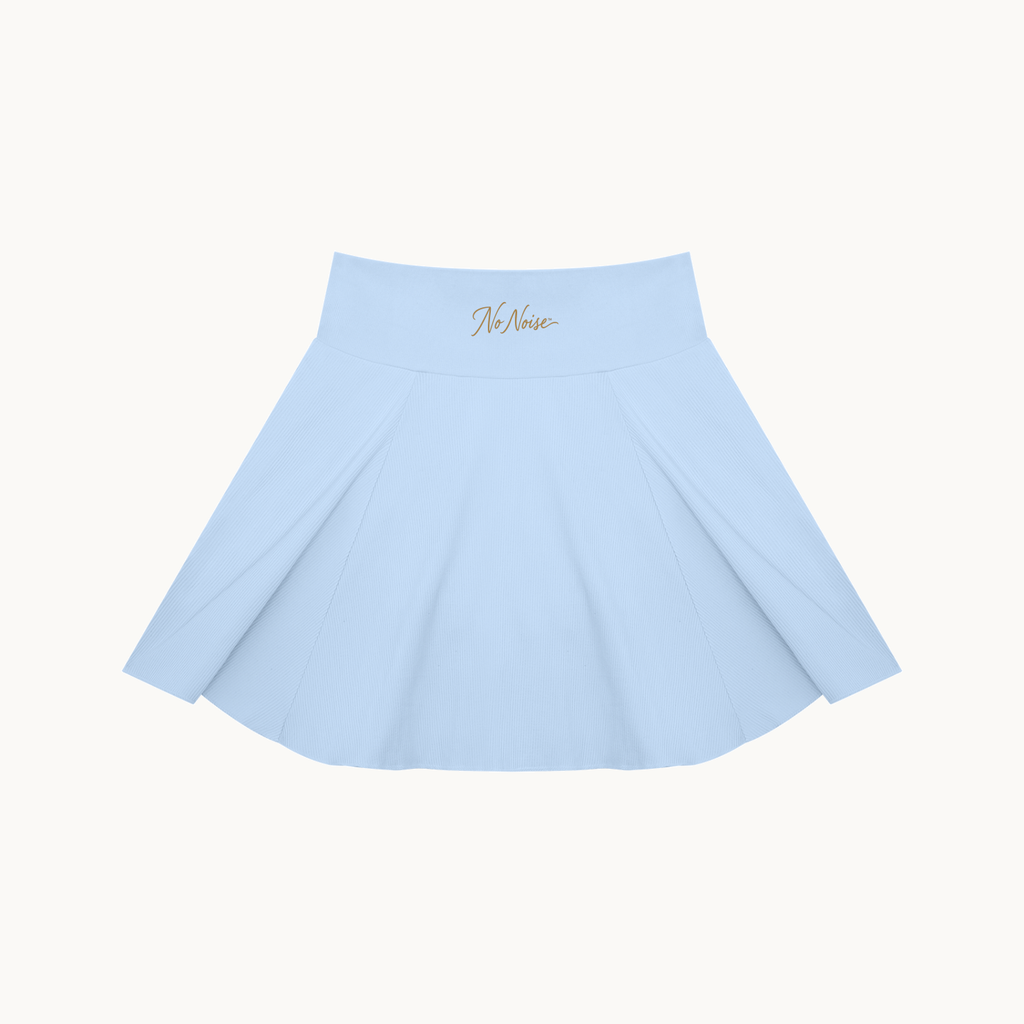 THE COURT SKIRT — BLUE — product view on warm ivory.
