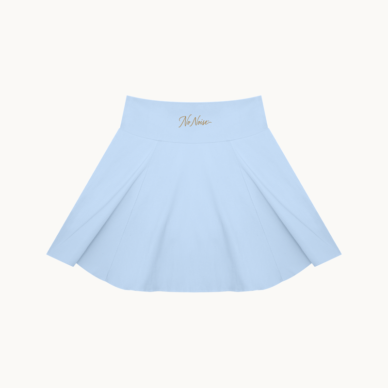 THE COURT SKIRT — BLUE — product view on warm ivory.