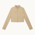 THE QUIET ZIP JACKET — SAND — product view on warm ivory.