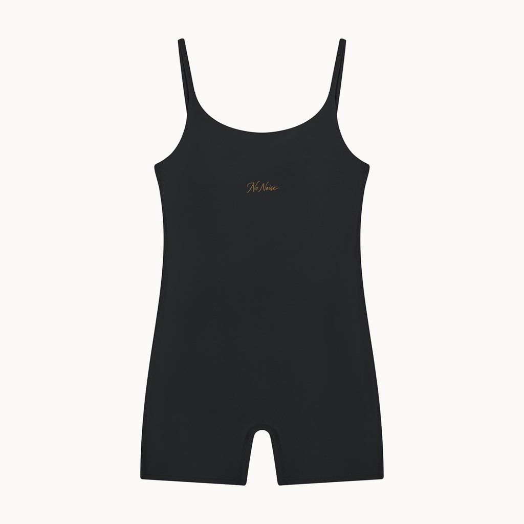 THE QUIET SUIT — NOIR — product view on warm ivory.