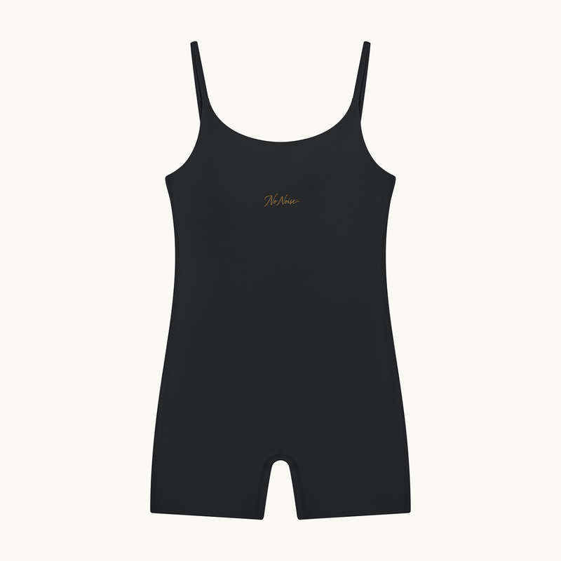 THE QUIET SUIT — NOIR — product view on warm ivory.