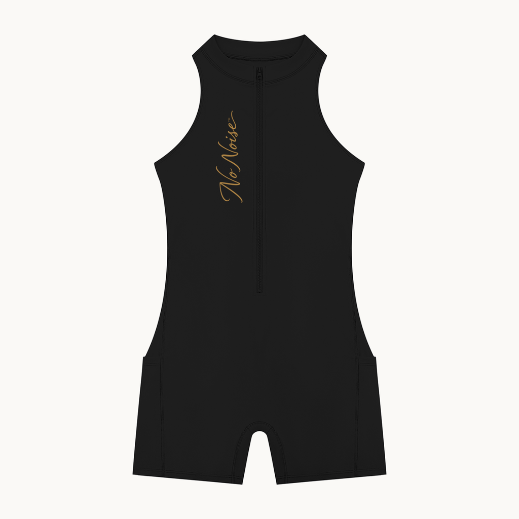 THE MOTION SUIT — product view on warm ivory.