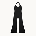 MOTION HALTER JUMPSUIT — OBSIDIAN — product view on warm ivory.