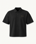 THE SIGNATURE DROP SHOULDER POLO — SHADOW — product view on warm ivory.