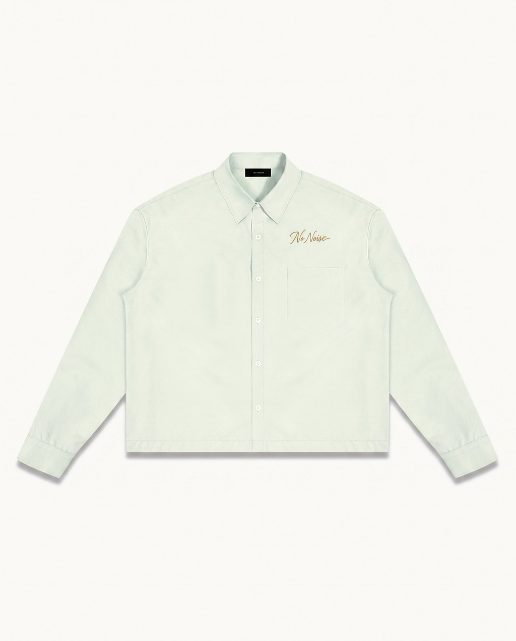 THE SIGNATURE SHIRT™ — LIGHT GREEN — product view on warm ivory.