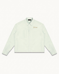 THE SIGNATURE SHIRT™ — LIGHT GREEN — product view on warm ivory.