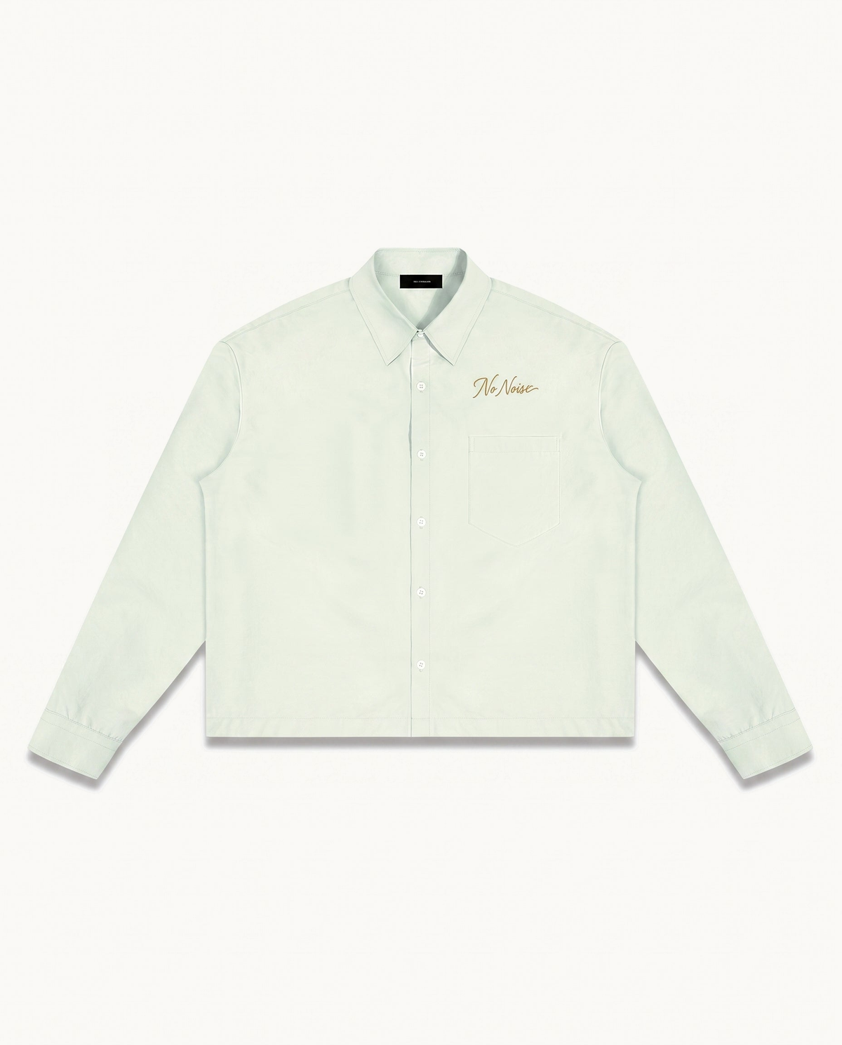 THE SIGNATURE SHIRT™ — LIGHT GREEN — product view on warm ivory.