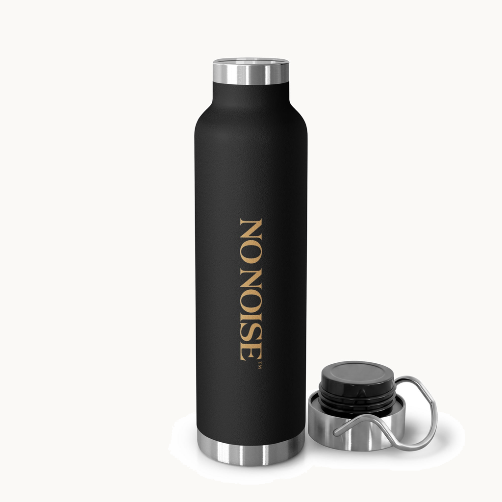 NO NOISE™ SILENT CARRY BOTTLE — 22 OZ MATTE BLACK — product view on warm ivory.