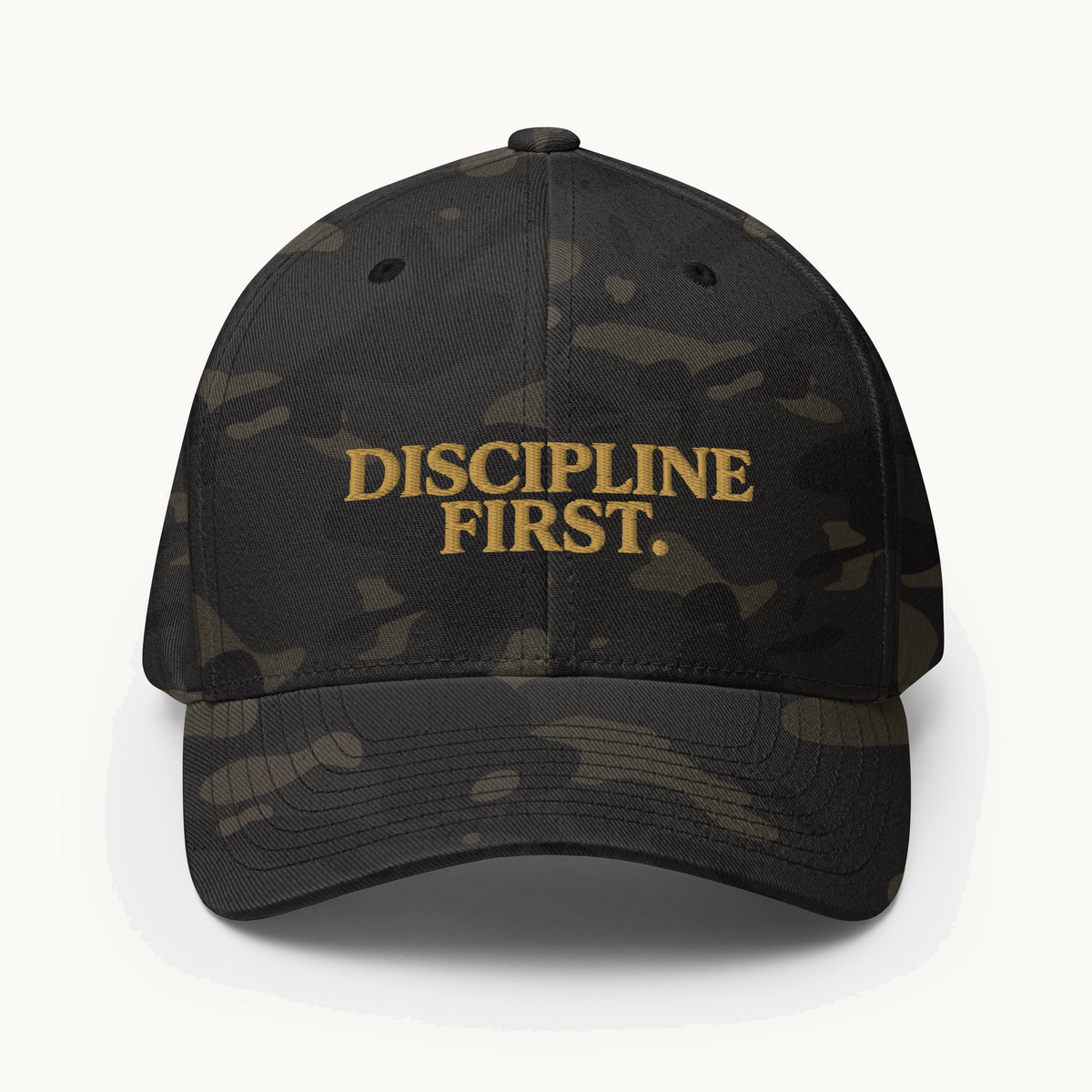 NO NOISE™ DISCIPLINE FIRST MULTICAM CAP — BLACK — product view on warm ivory.
