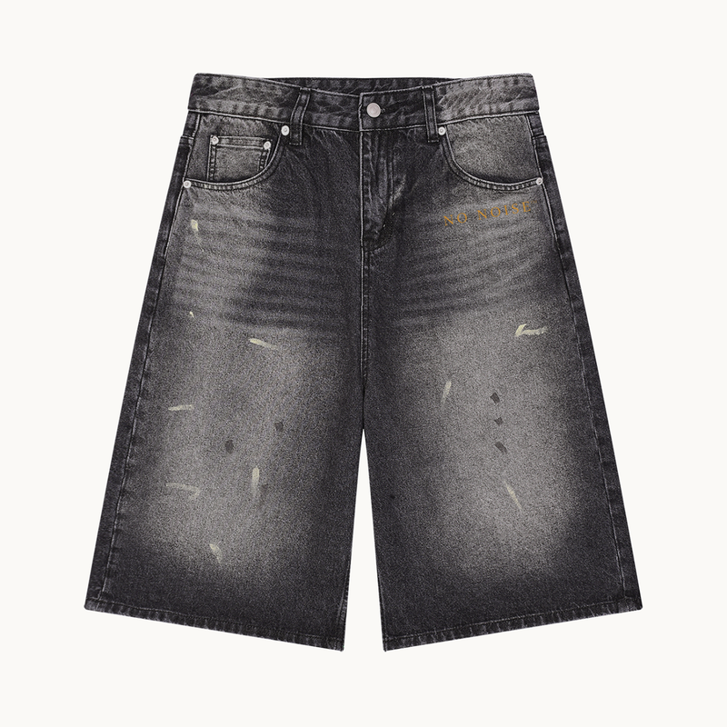 THE STILL WIDE-LEG DENIM SHORT — FADED BLACK — product view on warm ivory.