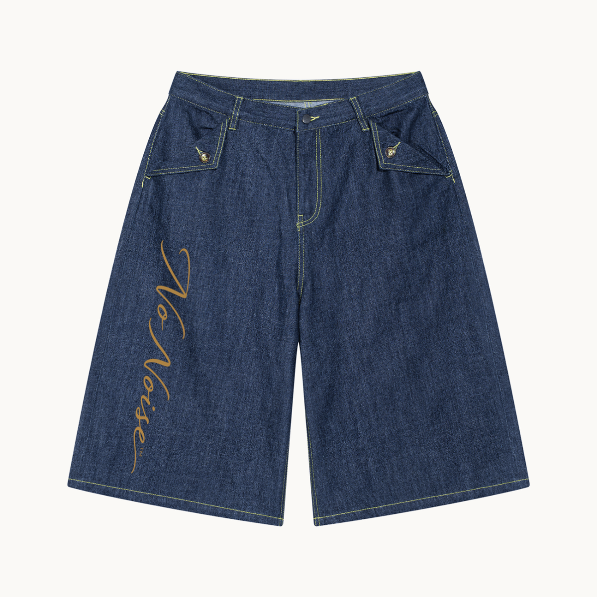 THE SANS BRUIT DENIM BERMUDA — INDIGO — product view on warm ivory.