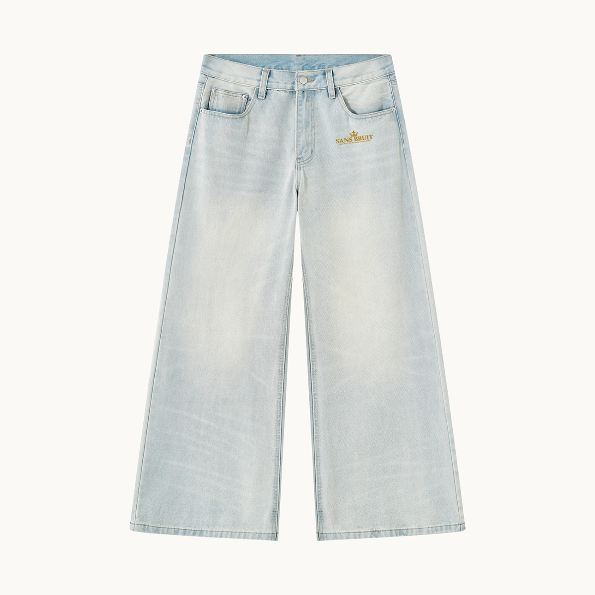 THE SANS BRUIT WIDE-LEG DENIM — ICE BLUE — product view on warm ivory.