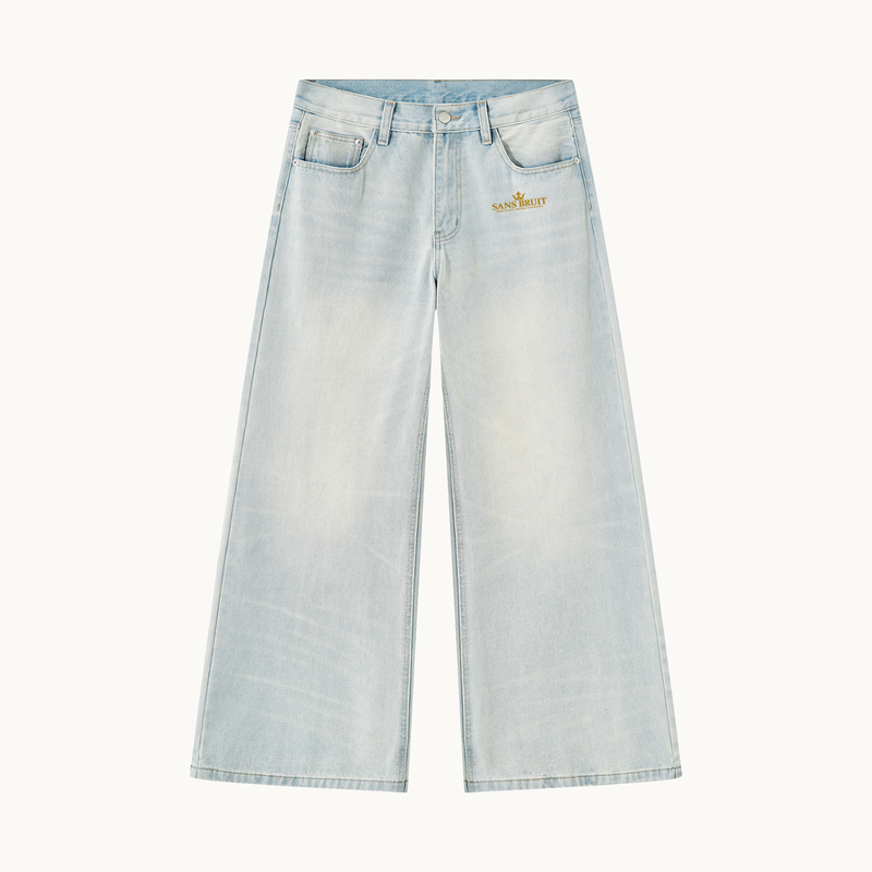 THE SANS BRUIT WIDE-LEG DENIM — ICE BLUE — product view on warm ivory.