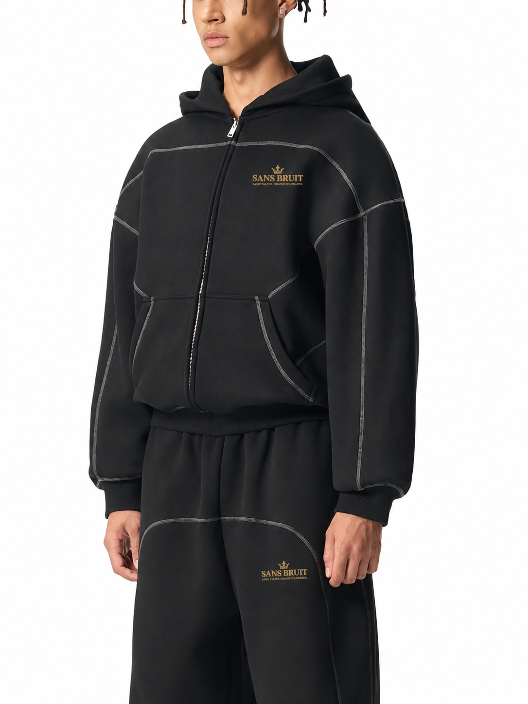 Angled model view of the black Contrast-Stitched Boxy Zip Hoodie showing dropped shoulders and contrast seams; digitally branded supplier photo