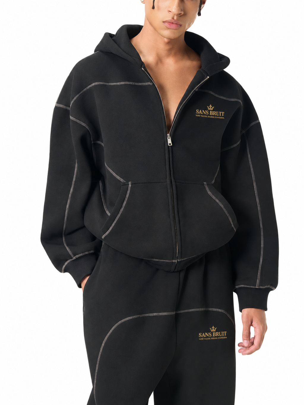 Partially unzipped black Contrast-Stitched Boxy Zip Hoodie on model with gold Sans Bruit chest print; digitally branded supplier photo