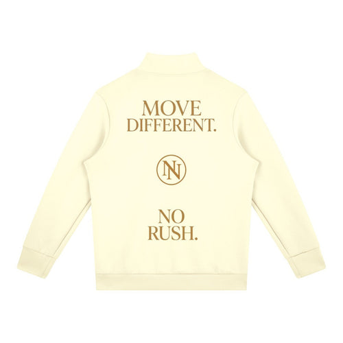 NO NOISE WORLD cream men's quarter zip with gold back print featuring Move Different and No Rush text.