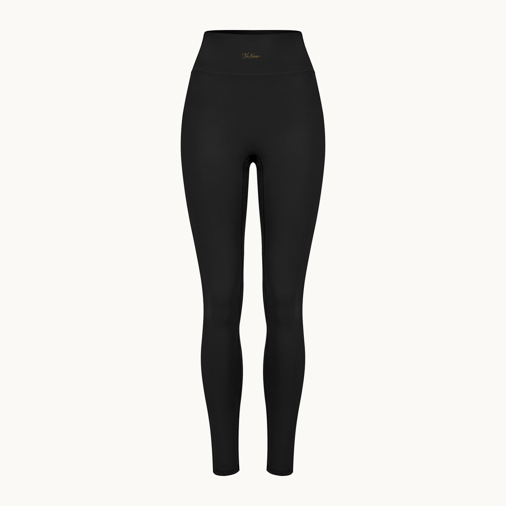 Poise High-Rise Leggings — Onyx, black, front shaped product view. On warm ivory.