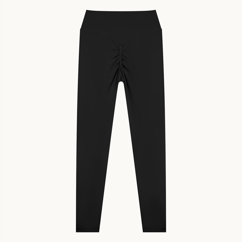 Poise High-Rise Leggings — Onyx, black, back flat view showing ruched seam. On warm ivory.