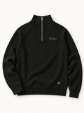 Sans Bruit Quarter-Zip Pullover — Noir — front flat lay on warm ivory.